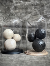 Glass dome on a wooden base