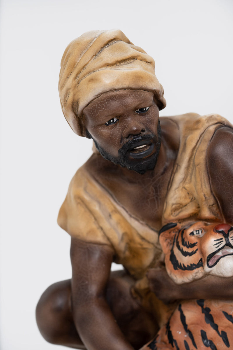 Vintage Collection; Sculpture of a Man Holding Tiger